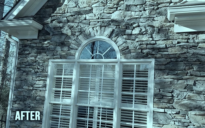 An arched fanlight window reglazed by A and E Glass Repair, shown after the work